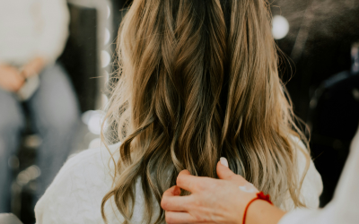 Balayage a hairdresser showing a client the balayage finalised