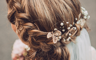 wedding hair styled with braids and florals